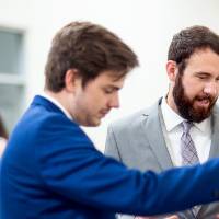 Students look at a computer